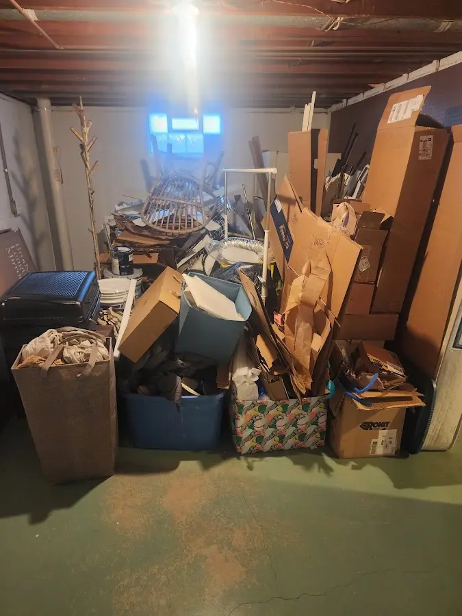 Roll-off dumpster container at job site for 2 Yard Dumpster Rental in Estero